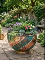 Copper swirl bowl planter with green patina